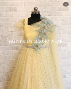 A designer pastel yellow gown