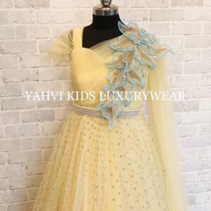 A designer pastel yellow gown